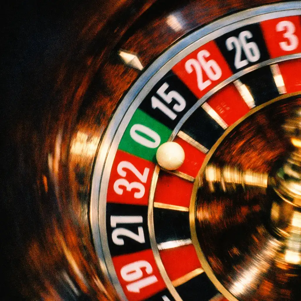 The roulette ball landing on a number, shot from above, in Run Lola Run
